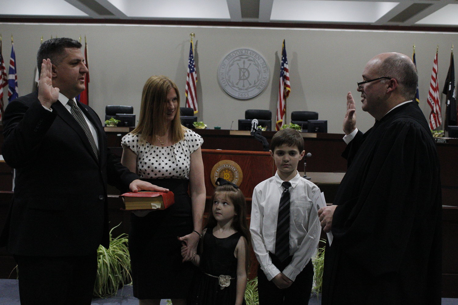 Superintendent of Highways Dan Losquadro is sworn in by Hon. James Hudson.