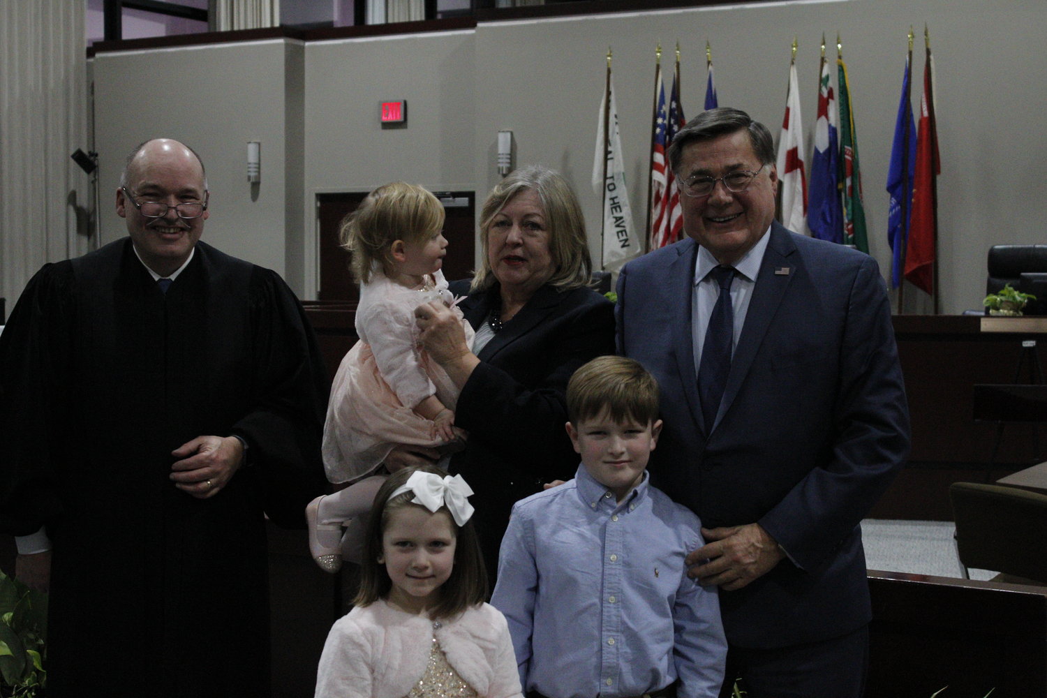 Newly sworn-in supervisor Ed Romaine with his wife and grandchildren.